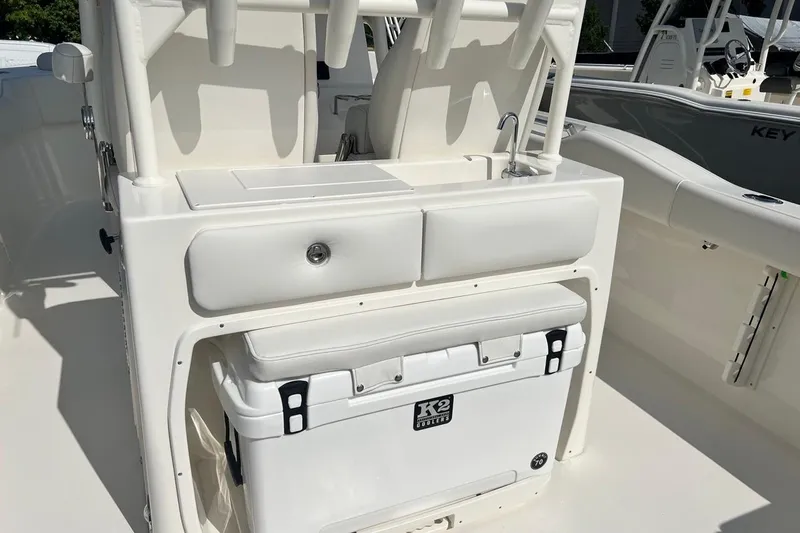 Slide: The Image of 2026 Key West 263 FS boat interior with cooler and storage compartments. - 31