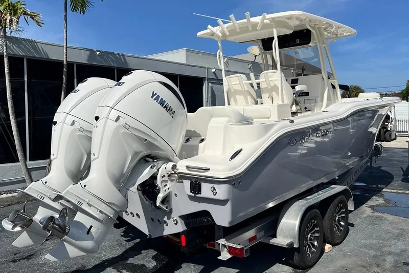 Slide: The Image of 2026 Key West 263 FS boat with dual Yamaha engines on a trailer. - 4