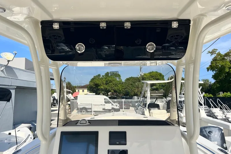 Slide: The Image of 2026 Key West 263 FS boat dashboard with modern controls and navigation screens. - 41