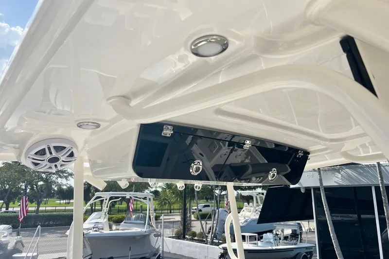 Slide: The Image of 2026 Key West 263 FS boat interior with speaker and storage compartment. - 43