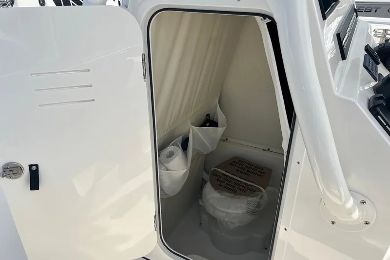 Slide: The Image of Interior view of 2026 Key West 263 FS boat's compact restroom. - 44