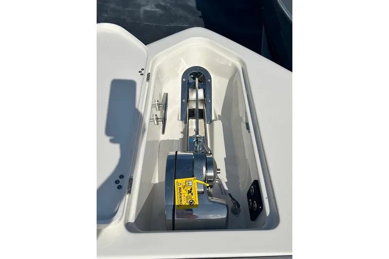 Slide: The Image of Anchor compartment of 2026 Key West 263 FS boat, featuring a modern winch system. - 47