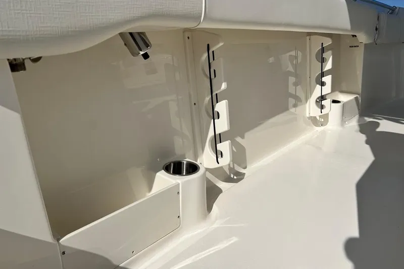 Slide: The Image of 2026 Key West 263 FS boat interior with rod holders and cup holders. - 51