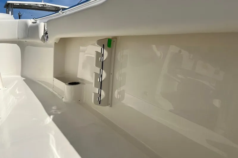 Slide: The Image of Interior view of 2026 Key West 263 FS boat, featuring rod holders and seating. - 52