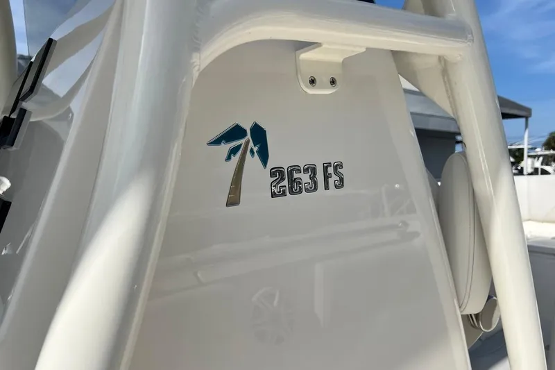 Slide: The Image of 2026 Key West 263 FS boat logo on white surface, showcasing sleek design. - 55