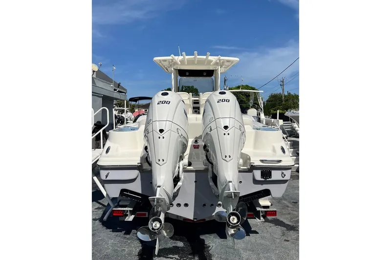 Slide: The Image of 2026 Key West 263 FS boat with dual 200 horsepower engines, rear view. - 6