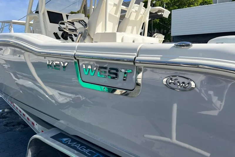 Slide: The Image of 2026 Key West 263 FS boat, sleek design, white exterior, close-up view. - 7