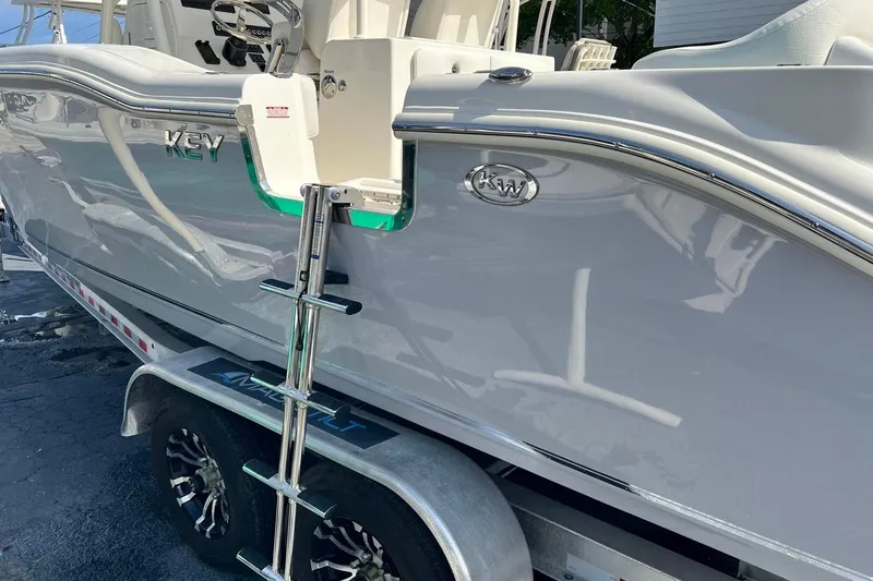 Slide: The Image of 2026 Key West 263 FS boat on trailer with ladder, side view. - 9