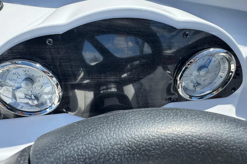 Slide: The Image of Dashboard of 2026 Stingray 191 DC boat with speedometer and voltmeter gauges. - 12