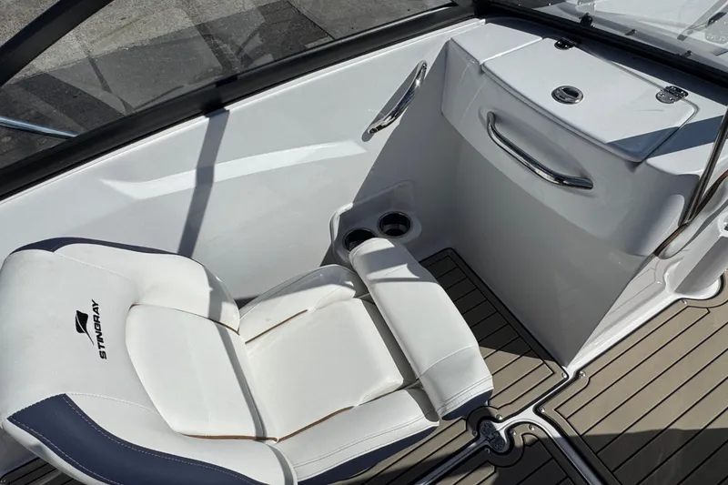 Slide: The Image of 2026 Stingray 191 DC boat interior with white seating and sleek design. - 14