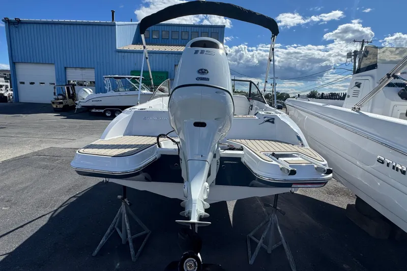 Slide: The Image of 2026 Stingray 191 DC boat displayed outdoors, showcasing rear view and sleek design. - 2