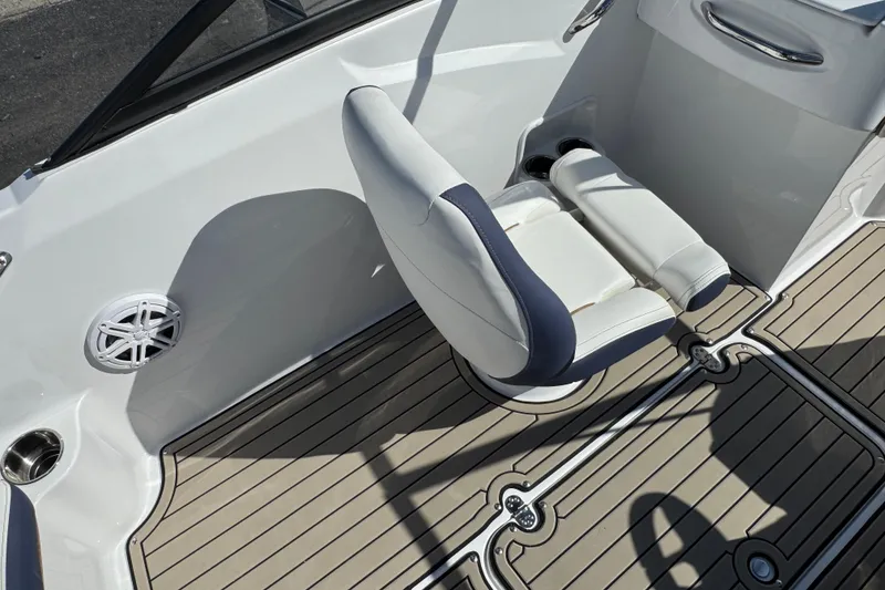 Slide: The Image of 2026 Stingray 191 DC boat interior with swivel seat and teak-style flooring. - 8