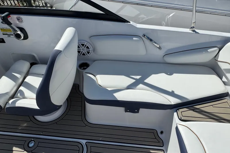 Slide: The Image of 2026 Stingray 191 DC boat interior with white seating and modern design. - 9