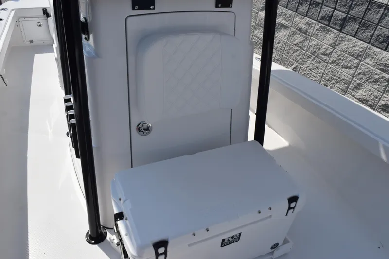 Slide: The Image of 2026 BlackJack 256 Coastal boat interior with storage compartment and cooler. - 16