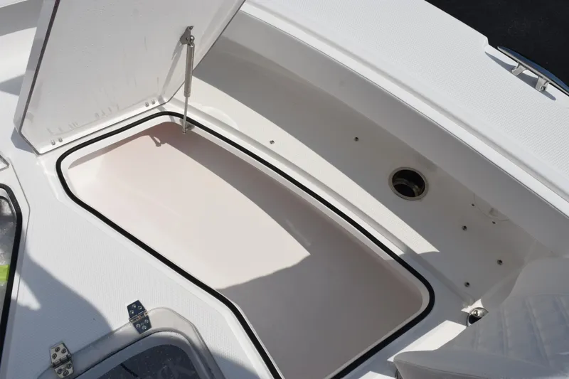 Slide: The Image of Open storage compartment on 2026 BlackJack 256 Coastal boat, showcasing interior design. - 19