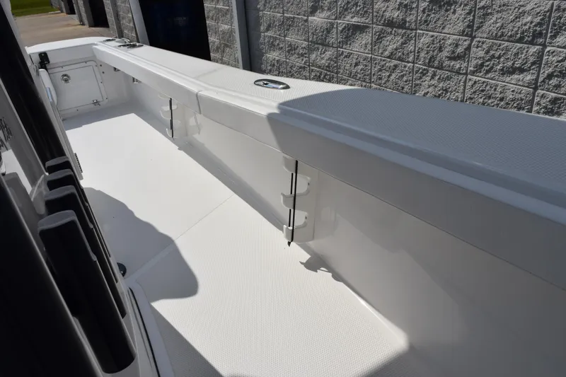 Slide: The Image of 2026 BlackJack 256 Coastal boat interior with sleek white deck and storage compartments. - 21