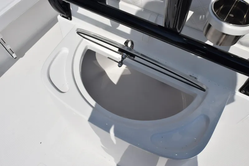 Slide: The Image of Livewell on 2026 BlackJack 256 Coastal boat, featuring sleek design and stainless steel cup holder. - 25