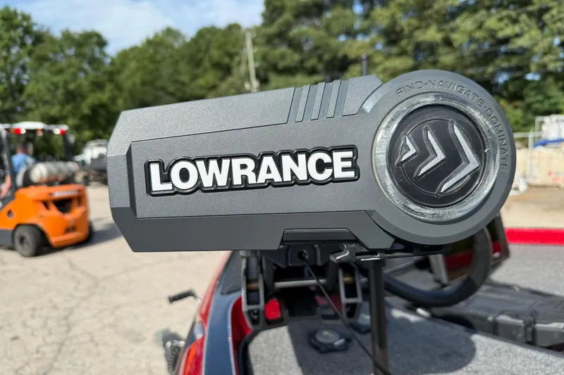 Slide: The Image of Lowrance device on 2023 Ranger Z520R boat, outdoor setting with trees and forklift. - 14