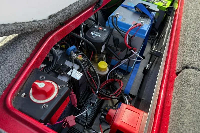 Slide: The Image of 2023 Ranger Z520R boat battery compartment with wiring and components. - 17