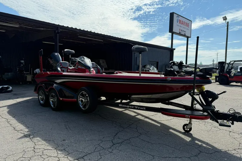 Slide: The Image of 2023 Ranger Z520R boat on trailer outside marine service shop. - 4