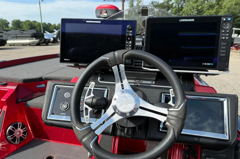 Slide: The Image of 2023 Ranger Z520R boat dashboard with dual fish finders and steering wheel. - 9