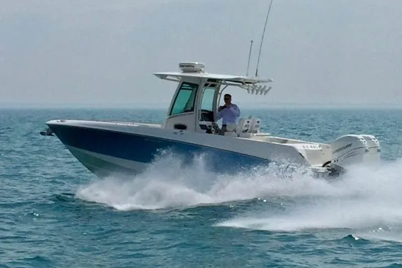 Slide: The Image of 2015 Boston Whaler 280 Outrage cruising on open water, showcasing speed and performance. - 1