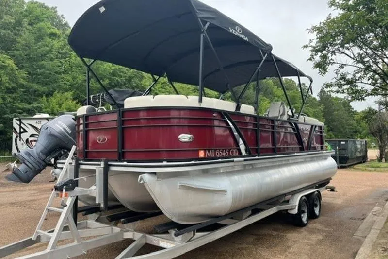 Slide: The Image of 2023 Veranda VP 22RC pontoon boat on trailer, parked outdoors. - 0