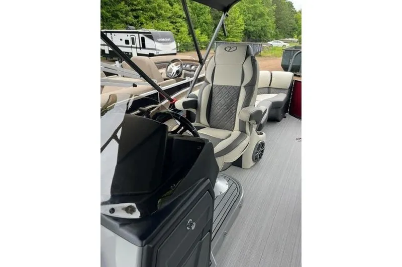 Slide: The Image of 2023 Veranda VP 22RC boat interior with luxurious seating and modern dashboard. - 4