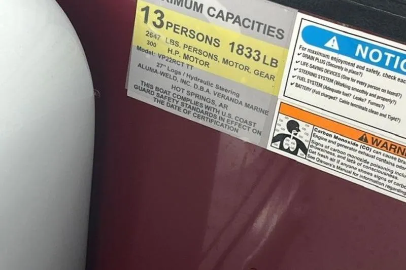 Slide: The Image of 2023 Veranda VP 22RC capacity label, 13 persons, 1833 lbs, safety warnings visible. - 6