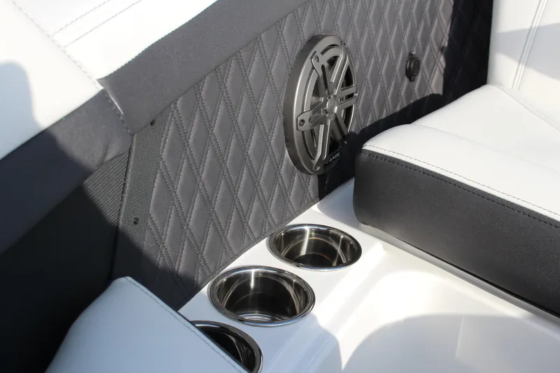 Slide: The Image of 2026 Cobalt R6 interior with quilted upholstery, speaker, and cup holders. - 10