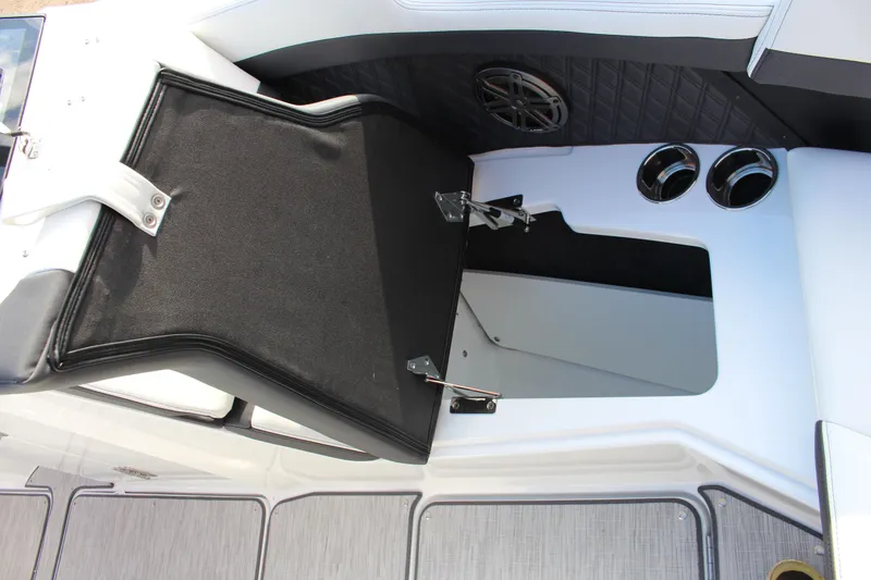 Slide: The Image of 2026 Cobalt R6 boat interior with open storage compartment and speaker detail. - 11