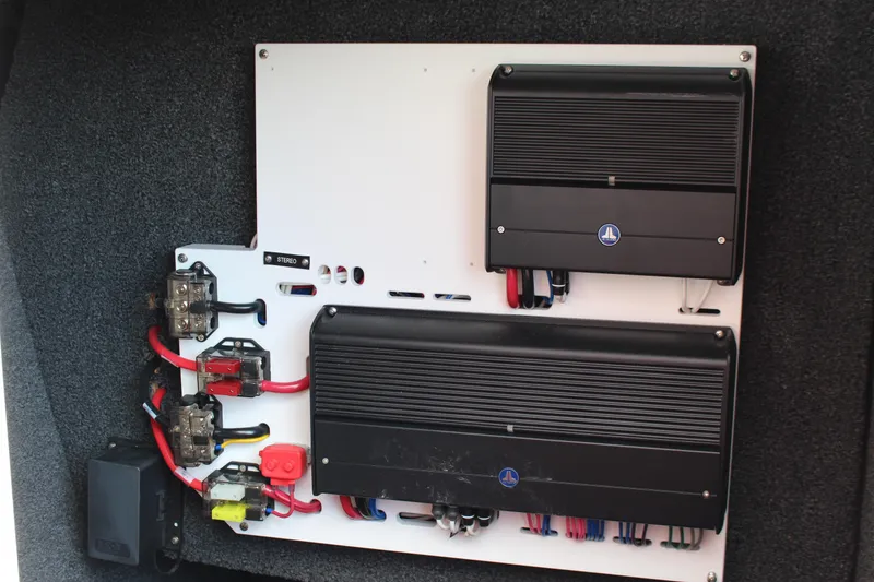 Slide: The Image of Audio system wiring in a 2026 Cobalt R6 boat, featuring amplifiers and connectors. - 13
