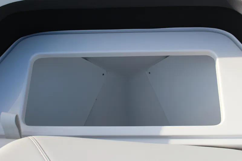 Slide: The Image of 2026 Cobalt R6 boat storage compartment, open and empty, with sleek white interior. - 14