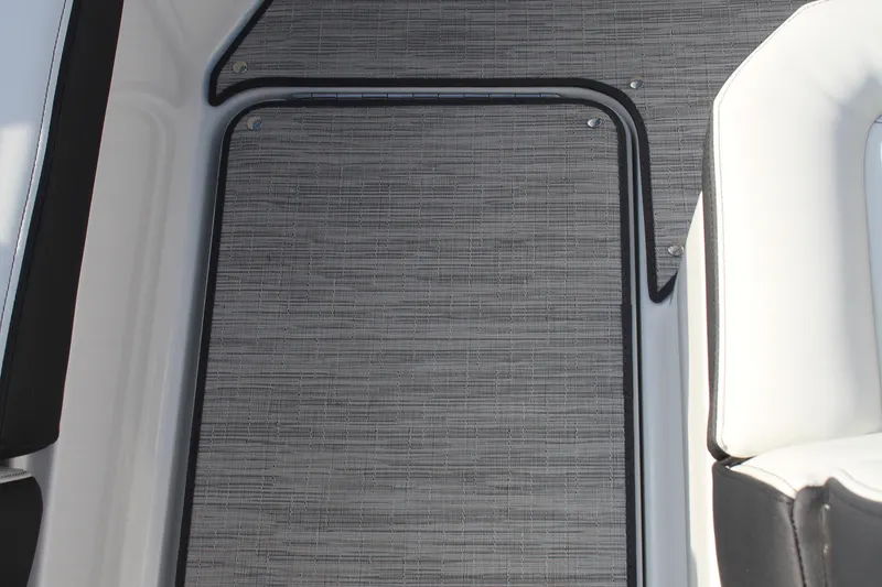 Slide: The Image of 2026 Cobalt R6 boat interior with textured flooring and white seating. - 18