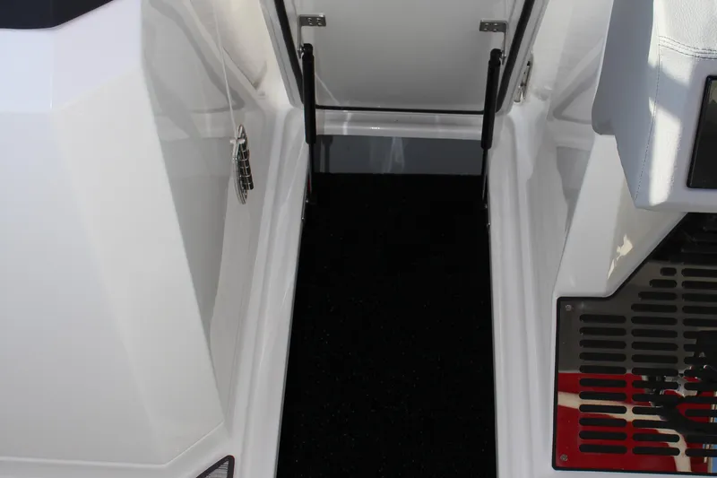Slide: The Image of Interior view of 2026 Cobalt R6 boat, featuring sleek white design and black flooring. - 20