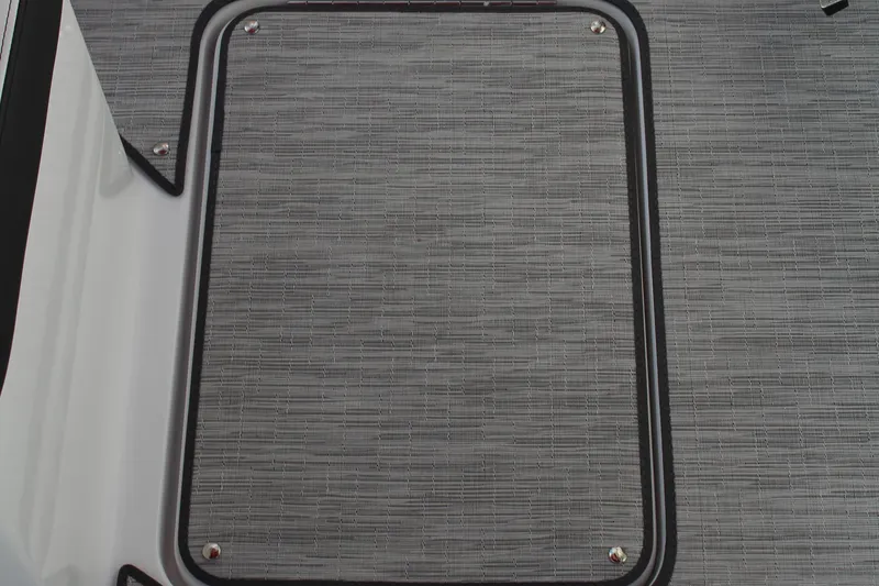 Slide: The Image of 2026 Cobalt R6 boat deck with textured gray surface and black trim. - 21