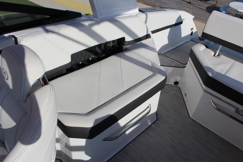 Slide: The Image of 2026 Cobalt R6 boat interior with white leather seating and modern design. - 28