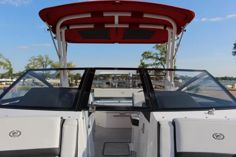 Slide: The Image of 2026 Cobalt R6 boat with red canopy, sleek design, and spacious seating. - 35