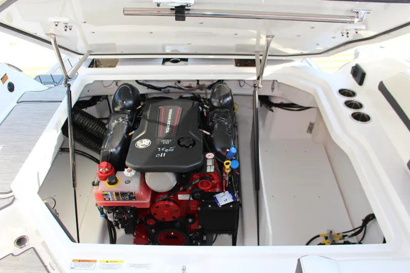 Slide: The Image of 2026 Cobalt R6 boat engine compartment with open hatch, showcasing detailed engine components. - 36