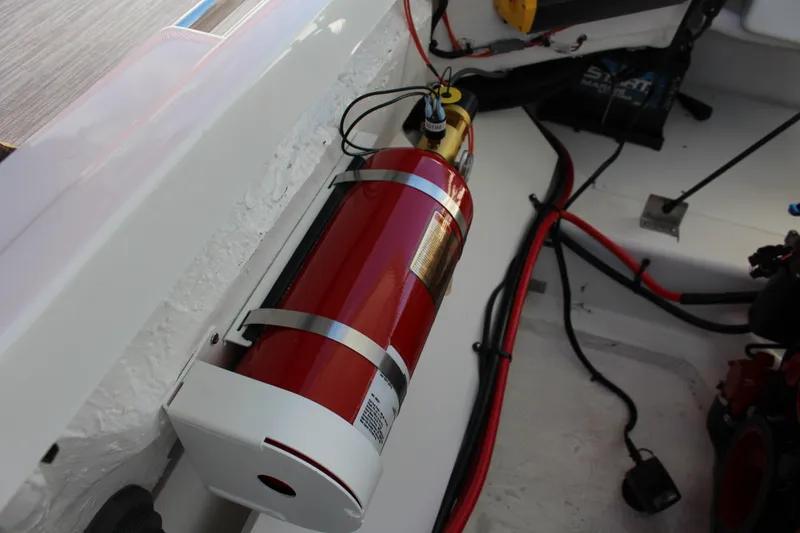 Slide: The Image of Fire extinguisher mounted in 2026 Cobalt R6 boat engine compartment. - 42