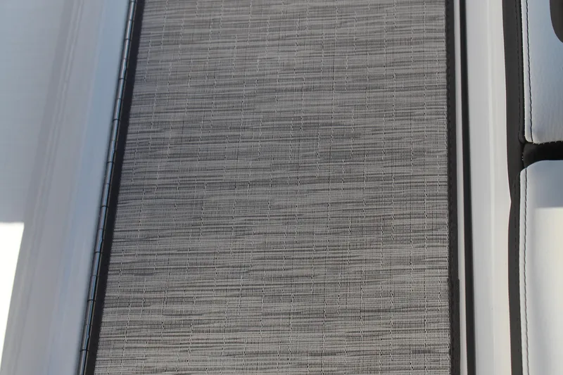 Slide: The Image of Cobalt R6 2026 boat interior with textured flooring and white seating. - 46