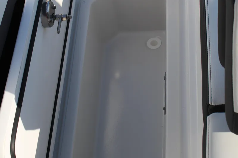 Slide: The Image of Storage compartment in 2026 Cobalt R6 boat, featuring sleek design and secure latch. - 47