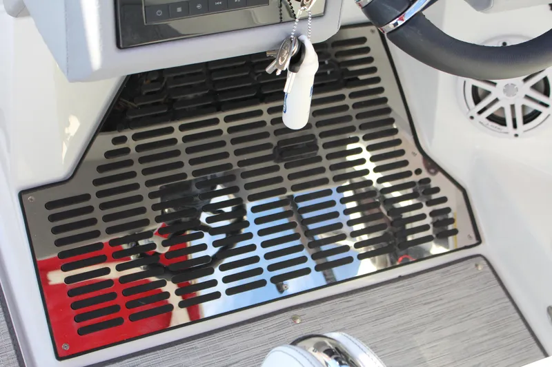 Slide: The Image of 2026 Cobalt R6 boat interior with steering wheel, keys, and speaker. - 48