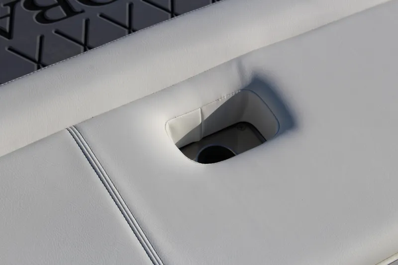 Slide: The Image of 2026 Cobalt R6 boat seat detail with integrated cup holder. - 58