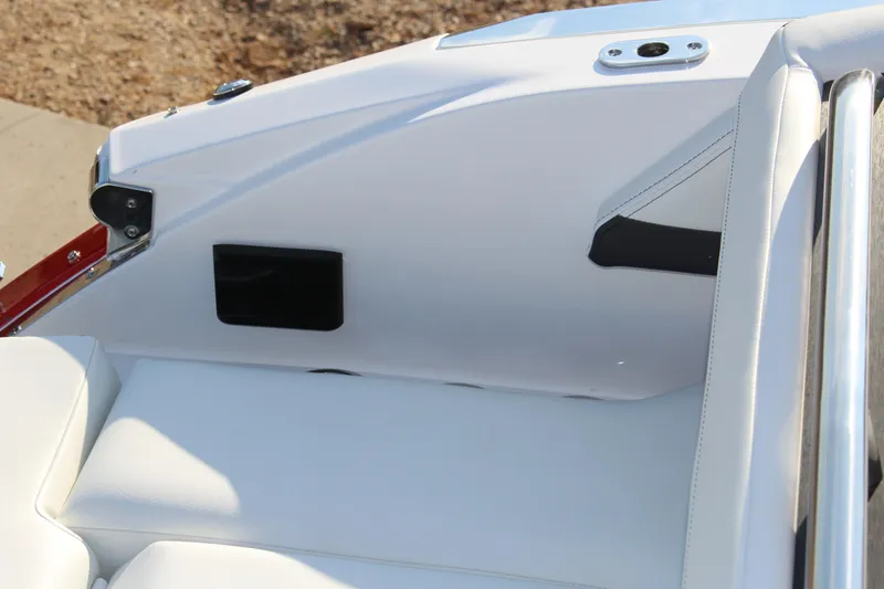 Slide: The Image of 2026 Cobalt R6 boat interior with white leather seating and sleek design elements. - 59