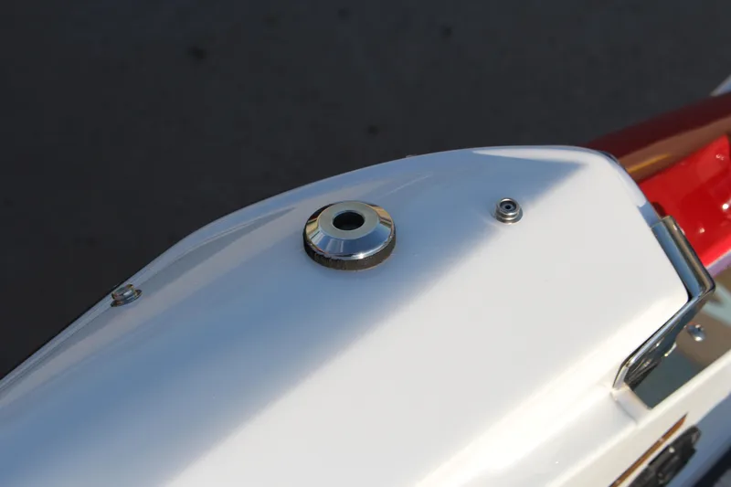 Slide: The Image of Close-up of 2026 Cobalt R6 boat detail, featuring sleek white and red design elements. - 60