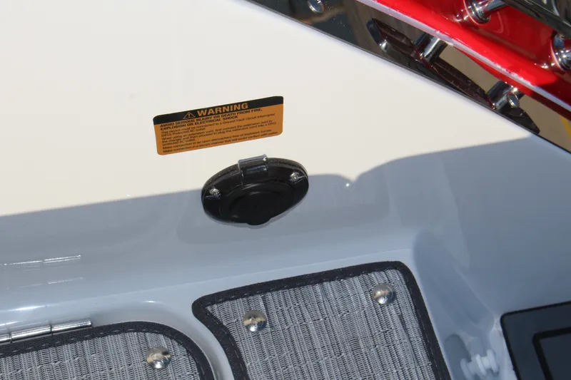 Slide: The Image of 2026 Cobalt R6 boat interior with warning label and deck details. - 61