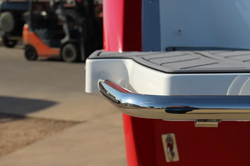 Slide: The Image of 2026 Cobalt R6 boat with chrome railing and textured deck, outdoor setting. - 62