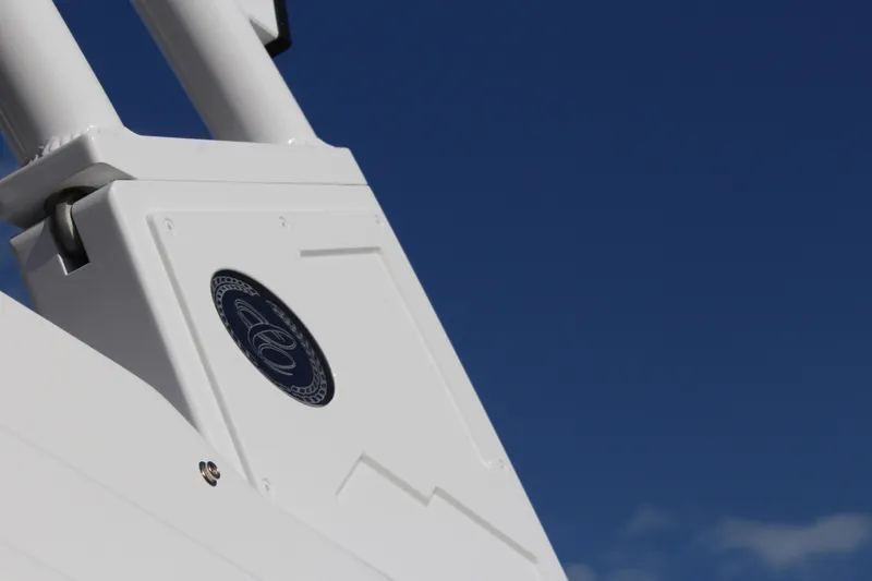 Slide: The Image of Close-up of 2026 Cobalt R6 boat detail against clear blue sky. - 64