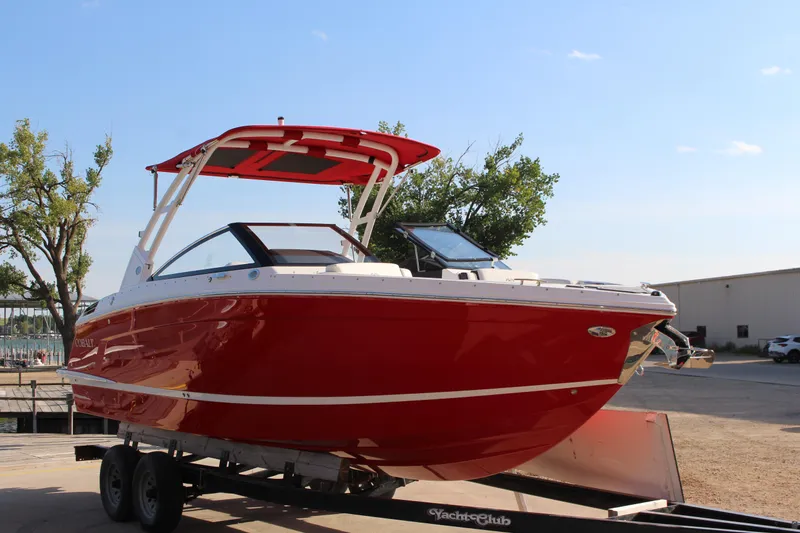 Slide: The Image of 2026 Cobalt R6 boat in vibrant red on a trailer, outdoors. - 67